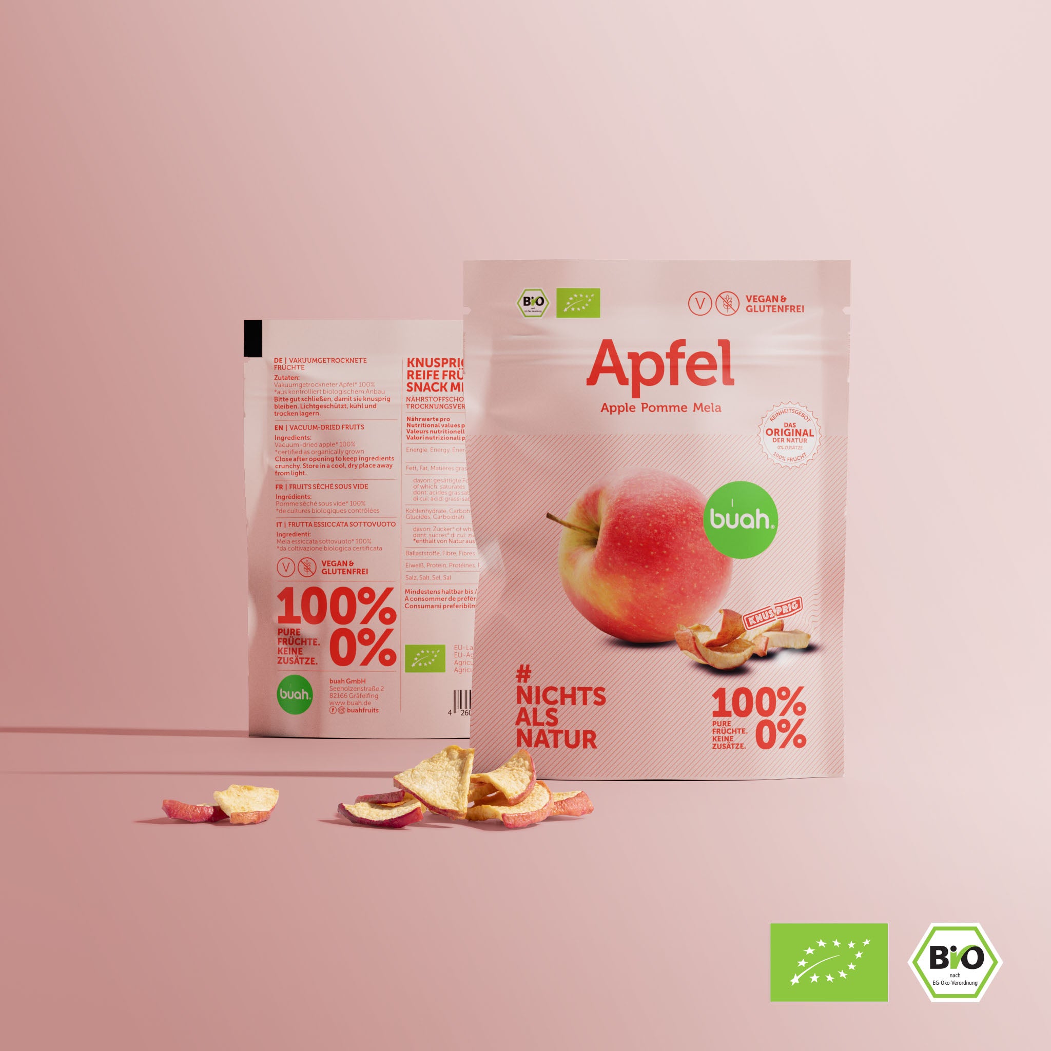 buah Snackpack vakuumgetrockneter Apfel vor rosa Hintergrund