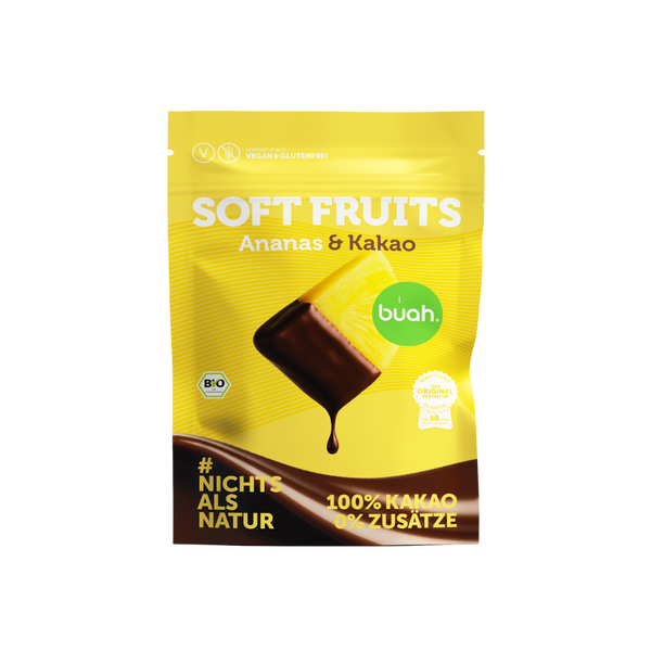 buah Bio Soft Fruits Ananas & Kakao in einer gelben wiederverschließbaren Beutel-Verpackung mit 100 % Kakao-Überzug ohne Zusätze
